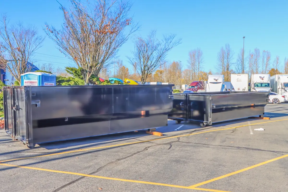 Professional dumpster rental service with roll-off container on residential driveway in Palos Verdes Estates